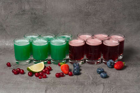 a big set of alcoholic shots for a large companyの写真素材