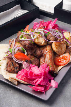 assorted tasty barbecue meat is a dish for a large company in a restaurantの写真素材