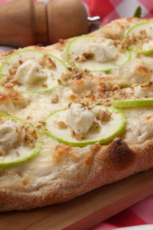 tasty italian pizza with zucchini, cheese and walnutsの写真素材
