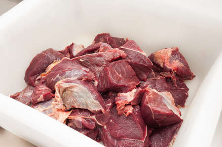 a piece of beef in a plastic container. concept: meat productionの写真素材