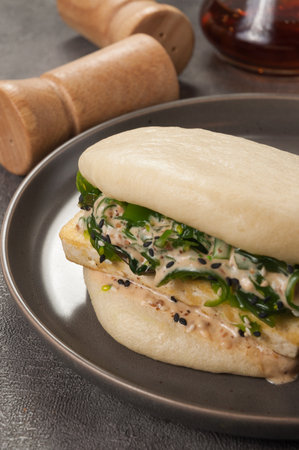 tasty vegetarian bun bao with tofu cheese and chukaの写真素材