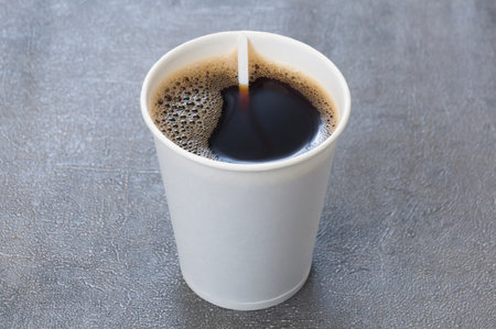 americano in a white cardboard cup. Concept: take awayの写真素材