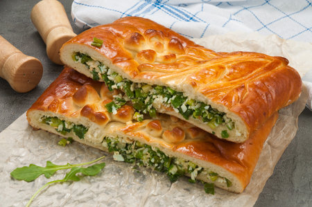 tasty pie with green onion and egg in the cutの写真素材