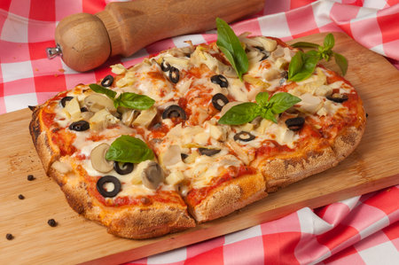 vegetarian pizza with zucchini mushrooms olives and cheeseの写真素材