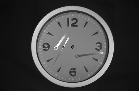 Round wall clock with chaotic pointers