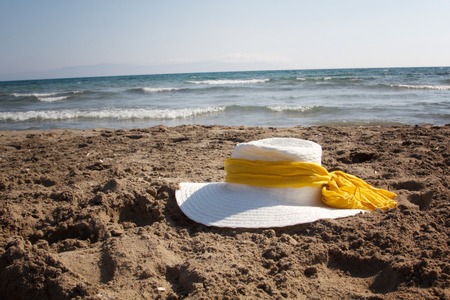 a girl with sun hat that see seaの写真素材