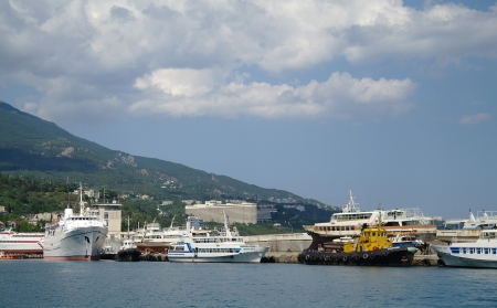 Scenic summer panorama of Black Sea pier and port harbor in Yalta, Crimea, Ukraineの写真素材