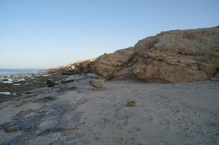 Beautiful seascape. Sea and rock at the sunset.の写真素材