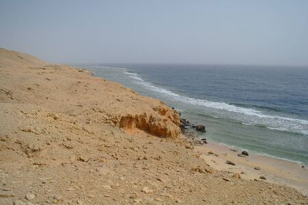 Beautiful azure red sea with waves and rocks and clear blue sky in Egypt.の写真素材