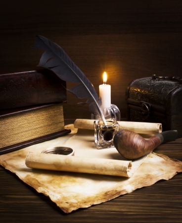 old papers and books on a wooden tableの写真素材