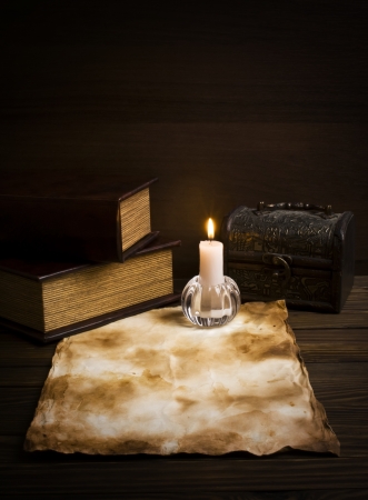 old papers and books on a wooden tableの写真素材