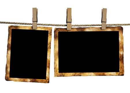 a photo pages on the rope with clothespins on white