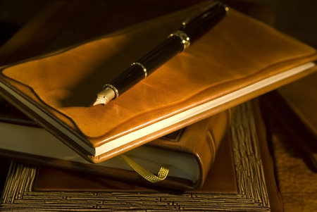 Vintage books and pen  selective focus 