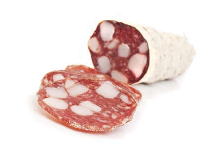sliced salami isolated on whiteの写真素材
