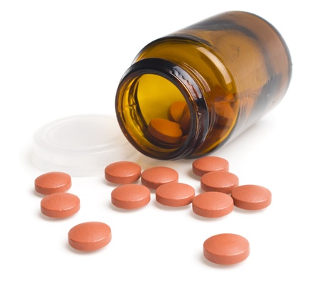  pills an pill bottle on white backgroundの写真素材