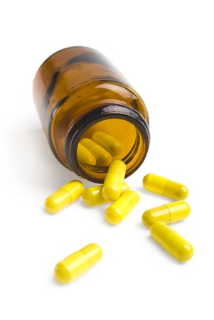  pills an pill bottle on white backgroundの写真素材