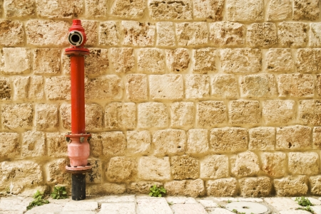 Red fire hydrant in the wall の写真素材