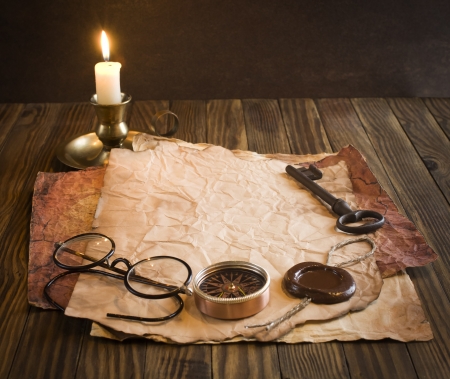 Compass, rope and glasses on old paperの写真素材