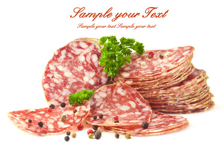 sliced salami isolated on whiteの写真素材