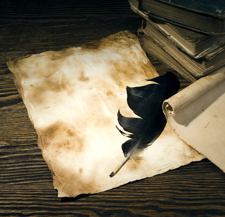 old papers on a wooden tableの写真素材