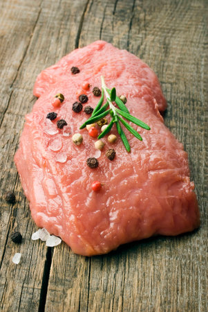 Beef steak on a wooden table の写真素材