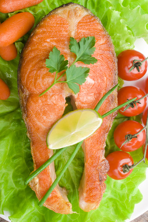 salmon steak with vegetablesの写真素材