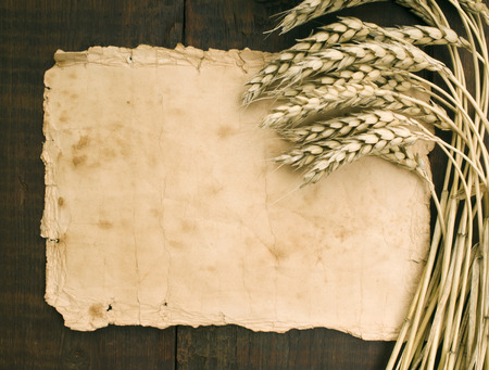 wheat on the old wooden tableの写真素材