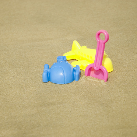 Summer kid\'s beach toy in the white sandの写真素材
