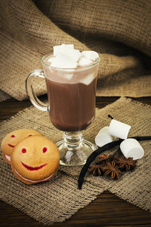 Cup of coffee with marshmallow on wooden tableの写真素材