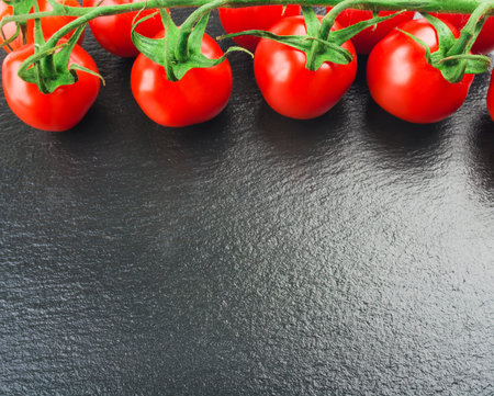 fresh tomato on black backgroundの写真素材