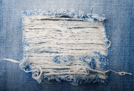 Blue torn denim jeans texture with space for text