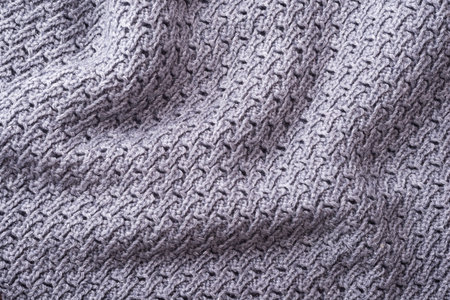 Knitted fabric texture. Knitted fabric background. Background from knitted fabric.