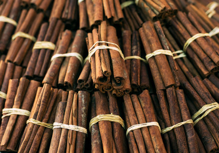 Cinnamon sticks close up at farmer's market. Background. Texture of cinnamon sticks. Top view.