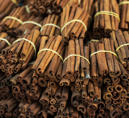Cinnamon sticks close up at farmer's market. Background. Texture of cinnamon sticks. Top view.の写真素材