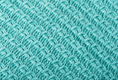 Mint knitted fabric texture closeup.