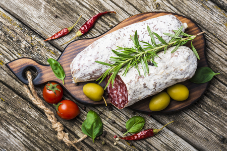 Olive on a wooden background. Top viewの写真素材