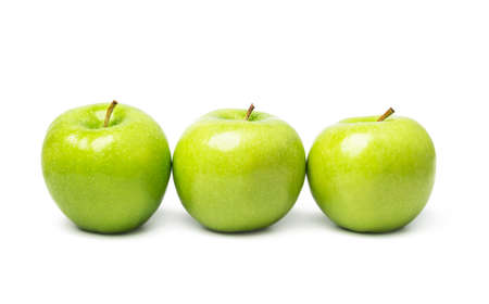 green apples on a white backgroundの写真素材