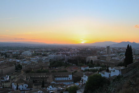 Panoramic view of city of Granada and its outskirts with distant mountainsの写真素材