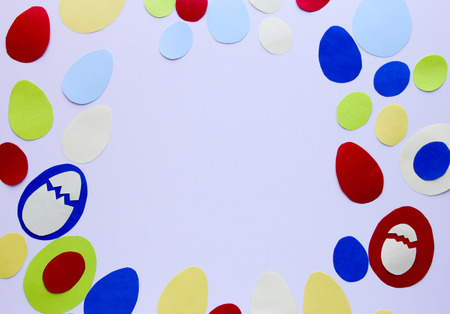 Easter frame craft. Easter greeting paper Easter eggs on a wooden table. Copy space. Children's Art Project needlework crafts for children.の写真素材