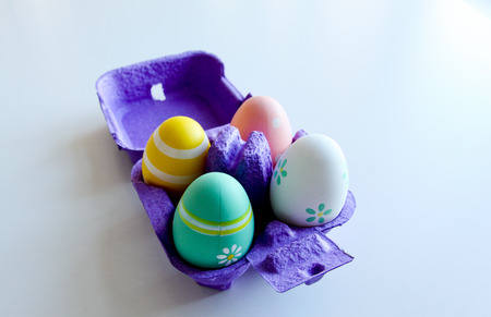 Easter eggs in a box on white backgroundの写真素材