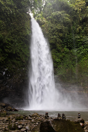 Nungnung waterfall on rainy day. Bali. Indonesiaの写真素材