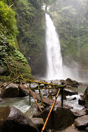 Nungnung waterfall on rainy day. Bali. Indonesiaの写真素材