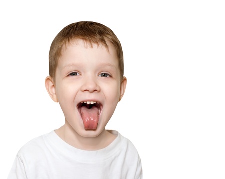 little boy sticking out his tongueの写真素材