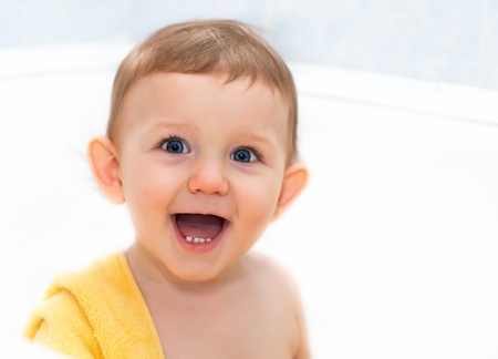 Happy baby in a towel, horizontal shotの写真素材