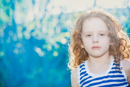 Curly child in a suit a sailor.  Adventure  concept.の写真素材