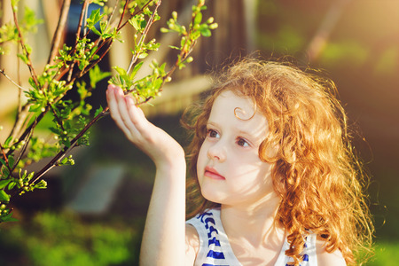 Little girl in the spring park, の写真素材