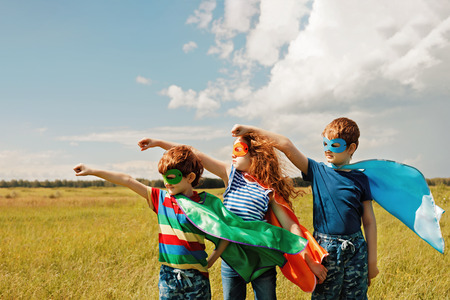 Cute child in Super hero costume. Superhero strong people concept.の写真素材