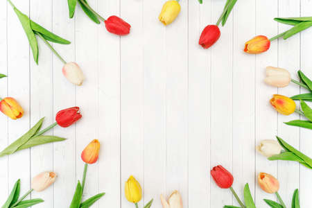 Bouquet of color tulips on wooden background. Holiday concept.の写真素材