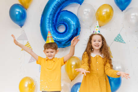 Happy birthday kids with confetti and balloons. holiday concept.の写真素材