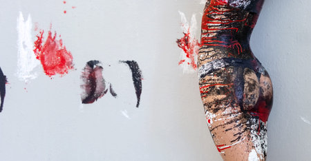 Hips and buttocks in underwear, sportswear, of young artistically abstract painted woman with black...